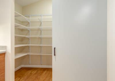 This spacious pantry with its attractive barn door entry will also allow access to wheelchairs. Added bonus is that the wide doorway will grant entry to even the largest big box store item!