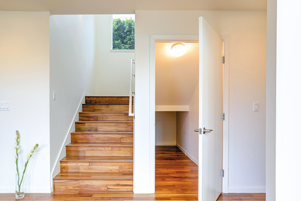 Modern staircase with adjacent closet