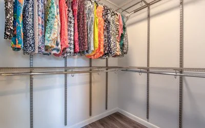 The full-sized walk-in closet has adjustable height racks for accessibility.